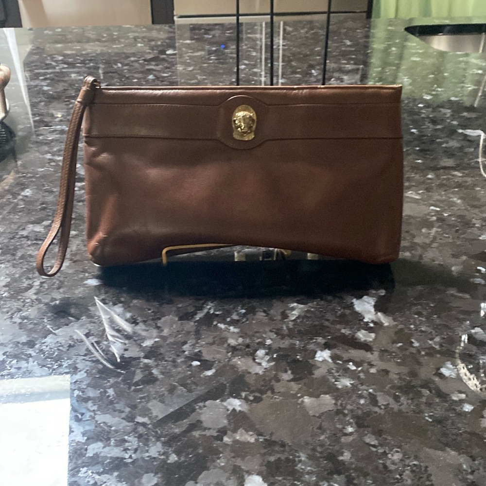 Brown leather clutch slightly used pristine condition